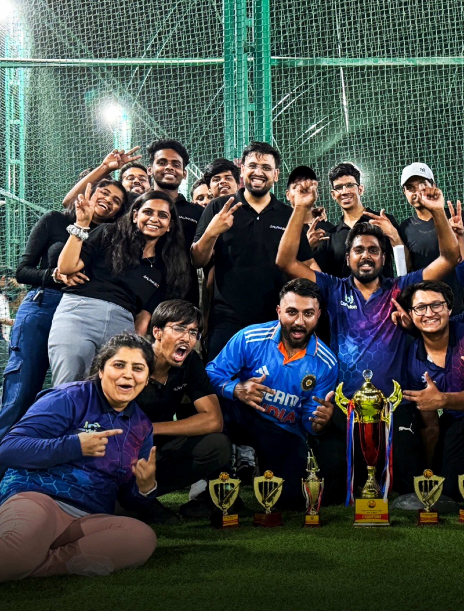 EAlphabits team lifting the runners-up trophy at the corporate cricket league